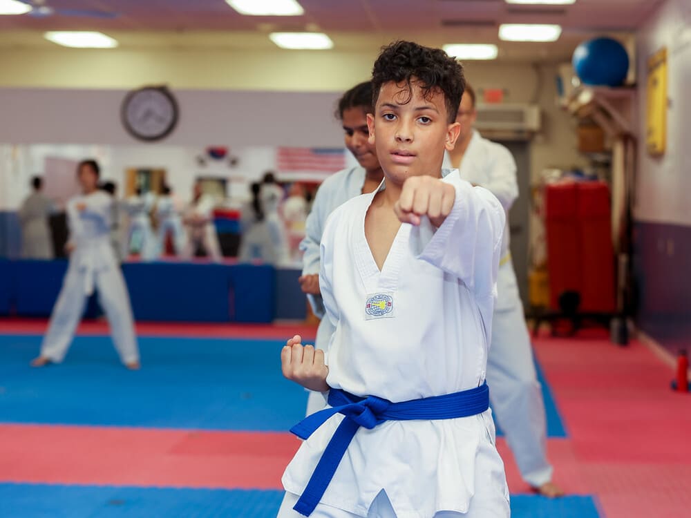 an adult in taekwondo uniform practicing taekwondo in Norristown PA