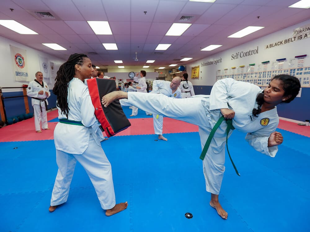 two black ladies pair for a taekwondo kicking practice in Norristown PA