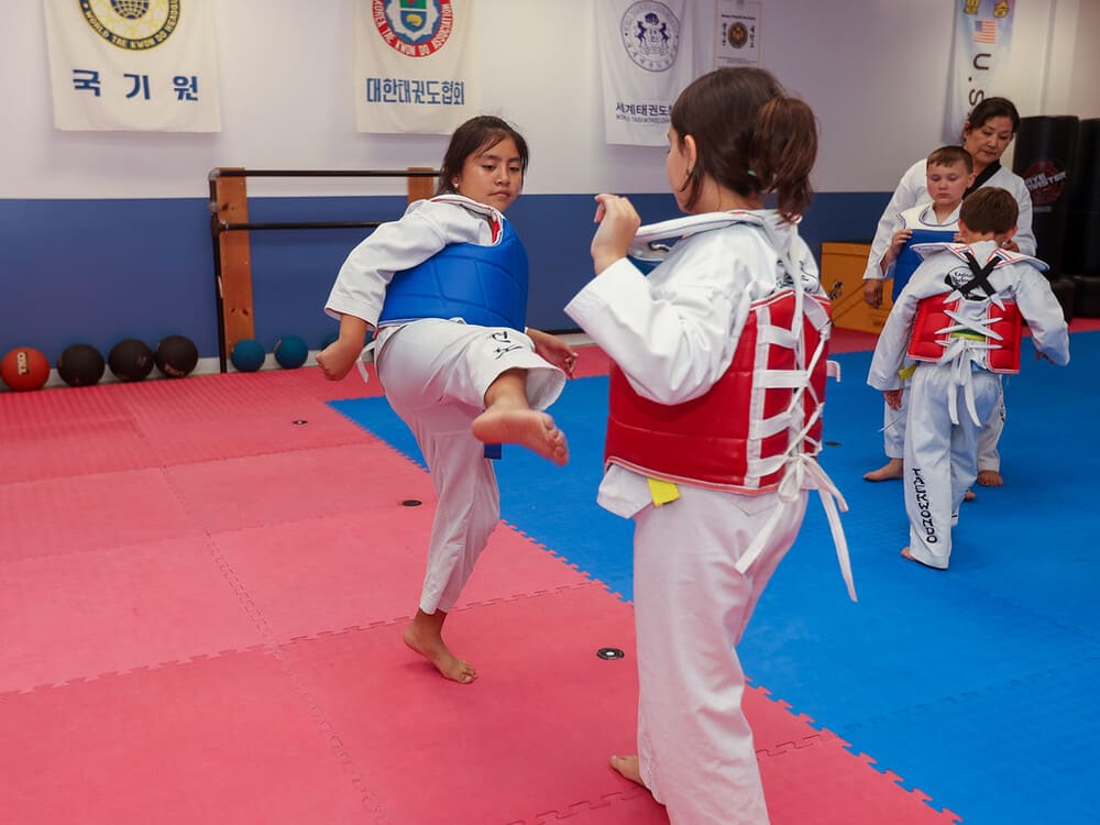 two girls pair for taekwondo kicking practice in Norristown PA