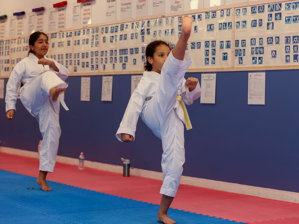 two kids doing a taekwondo kicking practice in Norristown PA