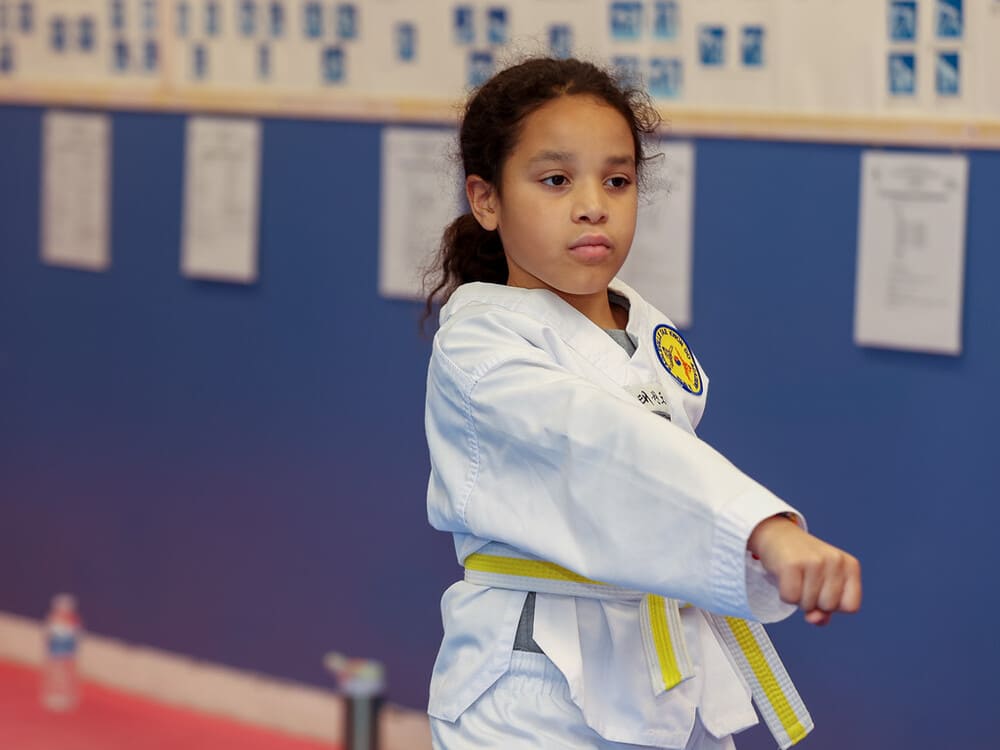 a kid with yellow belt practicing taekwondo in Norristown PA