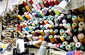 A lot of sewing tools in the table