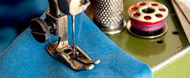 Sewing Machine is Sewing Clothes